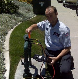 Issaquah plumbing professional testing backflow prevention device